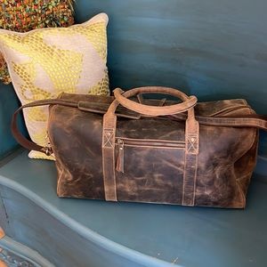 Never used, distressed buffalo leather bag.
